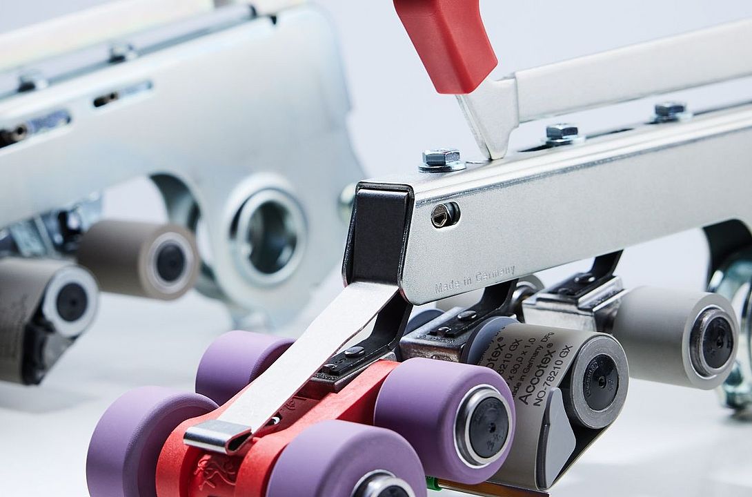 Suessen top weighting arms