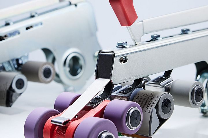 Suessen top weighting arms